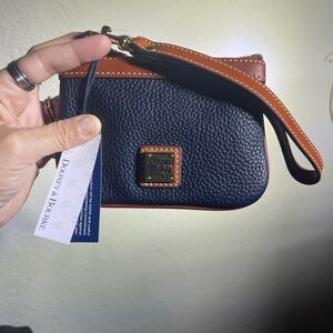 Dooney & Bourke Navy Pebbled Leather Wristlet with Brown Trim and Gold Hardware